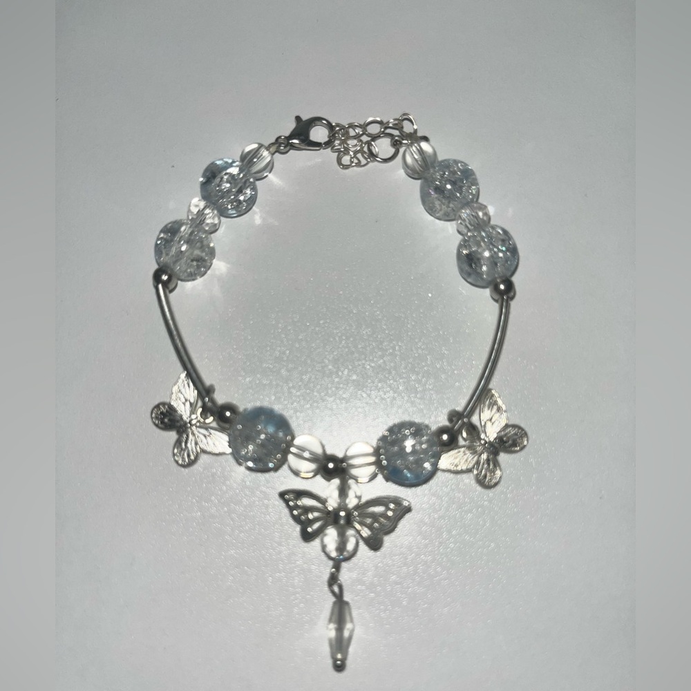 Silver, Medium size, light blue crystal bracelet with butterflies.